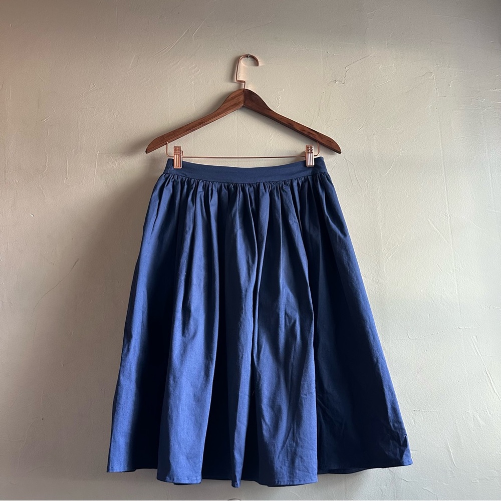 Collectif - knee length navy blue circle skirt with pockets